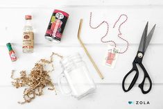 the contents of a crafting project including scissors, thread, glue and other items