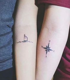 two people with matching tattoos on their arms, one has a sailboat and the other has a boat