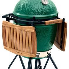 the big green egg is sitting on a stand