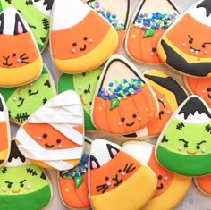 some decorated cookies are sitting on a table