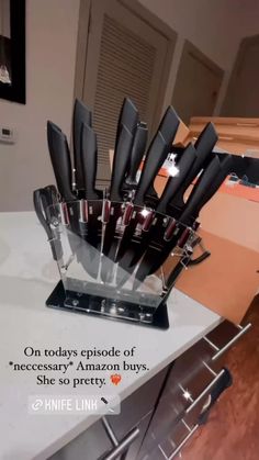 a knife holder with knives in it on a counter