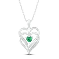 This pretty necklace for her features a double heart-shaped pendant traced in shimmering diamond accents. At the center sits a beautiful heart-cut lab-created emerald to complete the romantic design. The sterling silver pendant is suspended from an 18-inch box chain and secures with a lobster clasp. Heart-shaped Emerald Necklaces For Anniversary, Heart-shaped Emerald Necklace For Anniversary, Anniversary Heart-shaped Emerald Necklace, Heart-shaped Emerald Jewelry For May Birthstone, Elegant Heart Necklace For May Birthstone, Heart-shaped Emerald Jewelry With Birthstone, Heart-shaped Emerald Birthstone Jewelry, Heart-shaped Emerald Jewelry For Valentine's Day, Fine Jewelry May Birthstone Heart Cut Necklace