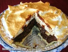 a pie is cut in half on a blue and white plate with one slice missing