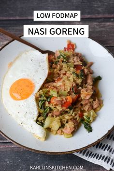 an egg and rice dish on a plate with the words low fodmap nasi goreng