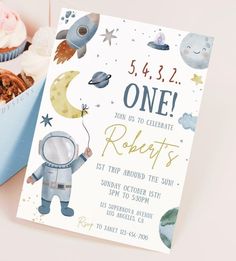 a space themed birthday party with cupcakes, muffins and an astronaut card