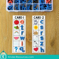 two plastic containers filled with letters and numbers on top of a wooden table next to each other