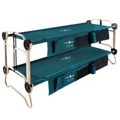 two green folding beds with wheels on each side and black bags on the bottom for storage