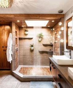 a bathroom with two sinks and a shower