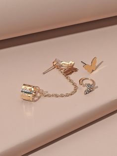 Details: Rhinestone, Butterfly Gender: Women Metal Color: Gold Material: Alloy Color: Gold Type: Sets, Ear Cuff Quantity: pcs Style: Fashionabl IN Eardrop Height Eardrop Width 0.4-1.7 0.4-0.5 This data was obtained from manually measuring the product, it may be off by 1-2 CM. Gold Earring Cuff, Cuffs Earrings, Fake Ear Piercings, Oversized Hoop Earrings, Butterfly Earring, Butterfly Earrings Gold, Simple Hoop Earrings, Mini Earrings, Minimal Earrings