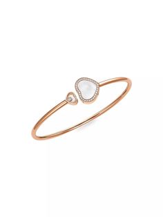 From the Happy Diamonds Collection. Symbolic heart bangle with signature floating diamond..Diamonds, 0.19 tcw.18K rose gold.Mother-of-pearl.Slip-on style.Imported.SIZE.Diameter, about 7'.ABOUT THE BRAND.In 1860, artisan watchmaker Louis-Ulysse Chopard founded the renowned jewelry brand in Sonvilier, Switzerland. The company is known for its legendary Swiss watches and classic high fine jewelry designed to last a lifetime..From the Happy Diamonds Collection. Symbolic heart bangle with signature floating diamond.Diamonds, 0.19 tcw18K rose goldMother-of-pearlSlip-on styleImportedSIZEDiameter, about 7'ABOUT THE BRANDIn 1860, artisan watchmaker Louis-Ulysse Chopard founded the renowned jewelry brand in Sonvilier, Switzerland. The company is known for its legendary Swiss watches and classic high Elegant Rose Gold Heart Bangle Bracelet, Luxury Rose Gold Heart Bracelet, Chopard Happy Diamonds, Diamonds Collection, Chopard Jewelry, Pearl Bangle, Happy Heart, Jewelry Brand, Fine Jewelry Designers