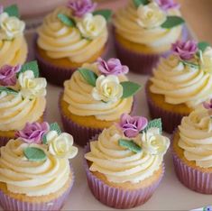 there are many cupcakes with flowers on them