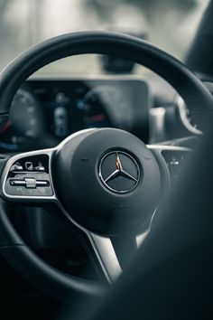 the steering wheel and dashboard of a car