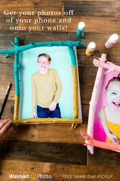 two children's photos are displayed in frames with the words get your photos off of your phone and onto your walls