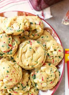 a plate full of cookies with sprinkles on it