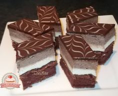 several pieces of chocolate cake on a white plate