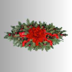 a christmas wreath with red bows and pine cones