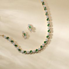 Description: This stunning necklace from our CZ collection features a striking mix of green and white CZ stones in an elegant design. Crafted with precision and finished with gold plating, it adds a sophisticated touch to any outfit. Whether as a gift or a standout accessory for special occasions, this necklace combines classic charm with modern glamour, enhancing any look with its radiant brilliance. Details & Specification: Materials used: Brass Alloy with Gold & White Gold Plating Weight - Ne Green Necklace Set, Choker Pendant, Kundan Earrings, Kids Necklace, Cz Earrings, Enamel Earrings, Antique Earrings, Green Necklace, Stunning Necklace