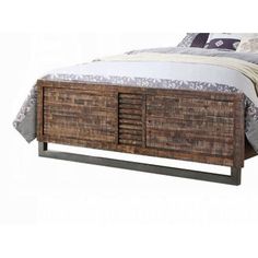 the bed is made up with wicker drawers