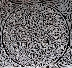 an intricate design on the surface of a building