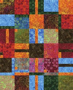 a multicolored patchwork quilt with many different colors