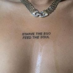 a shirtless man with a chain around his neck that says, stab the egg feed the soul