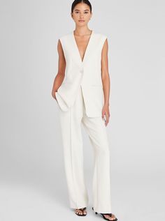 Taking inspiration from classic suiting, this modern vest is tailored in a lightweight fabric with a hint of stretch for polished comfort. The slightly relaxed fit and chic elongated length make it versatile enough to wear solo or layered. Wear it over our Trouser Style Suiting Mini Skirt or Full-Length Pintuck Trouser for a stylish pairing. Women White Suit, Vest Suit Women, White Vests, Tailored Vest, Silk Vest, White Suit, Fashion 2016, Long Vest, Breezy Dress