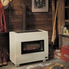 a white stove sitting inside of a wooden room