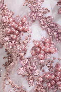 pink beaded fabric with flowers and pearls