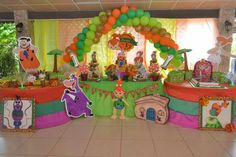 an elaborately decorated birthday party with balloons and decorations