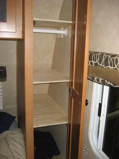 the inside of a small rv with shelves