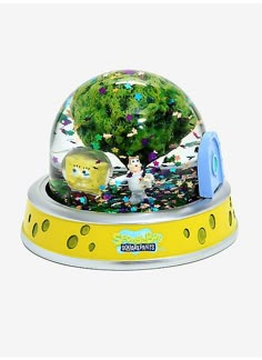 the spongebob musical water globe is yellow and has an animal figure in it