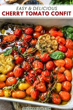 cherry tomato confit in a white casserole dish with basil and sliced tomatoes