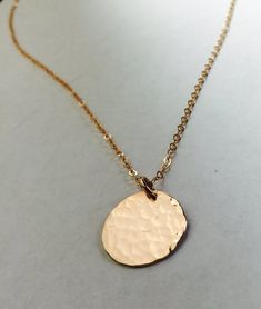 This listing is for a 14K gold filled, 14K rose gold filled, or sterling silver disc pendant and chain. -Delicate, high-quality 14k gold filled, 14k rose gold filled, or sterling silver disc pendant and chain.-This is a medium sized disc and is 15mm.-Choose either hand hammered as shown or smooth finish for the disc. This item will be delivered in a gift box ready for gift giving. Everyday Hammered Rose Gold Jewelry, Round Rose Gold 14k Gold Filled Necklaces, Rose Gold 14k Gold Filled Round Necklace, Rose Gold Round 14k Gold Filled Necklace, Rose Gold 14k Gold Circular Jewelry, Dainty Rose Gold Medallion Jewelry, Rose Gold 14k Stamped Jewelry, Everyday Rose Gold Hammered Jewelry, Gold Round Coin Necklace Nickel Free