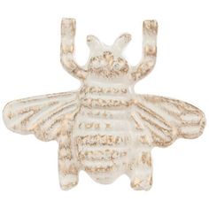 a white ceramic bee figurine on a white background