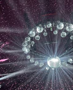 an image of a stage with lights and balls