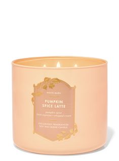 a pink candle that is sitting in front of a white background