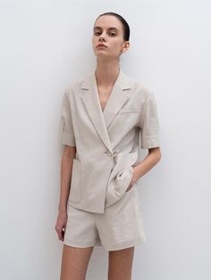 Editor's NotesThe summer patns is cut from herringbone patterned linen and upgrades your summer outfit- Classic shorts- Matte cow horn button- Button closure with zip flt- Side pockets- Set up with Herringbone Puffed Half Sleeve JacketMeasuremets(in.)- S:       Waist     27.4in.,        Hip     37.1in.,        Length     14.6in.              - M:        Waist     29.4in.,        Hip     39in.,        Length     15in.              - L:        Waist     31.9in.,        Hip     41in.,        Length     15.4in.  *Model size- Height 176cm-        Bust     31.2in.,        Waist     24.5in.,        Hips     33.9in.  Composition & Care- 55% Polyester, 14% Linen, 28% Cotton, 3% Polyurethane- Dry cleaningDesigner- Made in Korea- by RE RHEE Summer Workwear Shorts With Patch Pockets, Beige Linen Shorts For Work, Beige Shorts With Welt Pockets For Spring, Summer Workwear Bottoms With Buttoned Pockets, Summer Workwear Shorts With Welt Pockets, Beige Patch Pocket Shorts For Summer, Beige Summer Shorts With Patch Pockets, Linen Workwear Shorts With Welt Pockets, Spring Linen Shorts With Welt Pockets