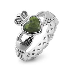 a heart shaped ring with a crown on top and a green stone in the middle