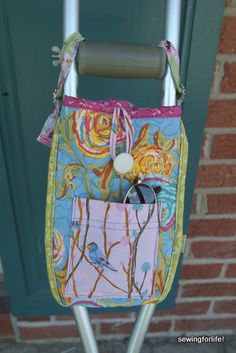 a handbag is hanging on a metal rack