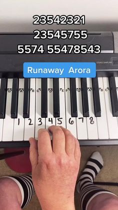 someone is playing the piano with their feet on the keyboard and text reads runaway aurora