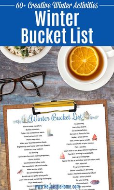 a winter bucket list on a clipboard next to a cup of tea and glasses