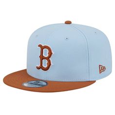 a blue and brown baseball hat with the letter b on it's front side