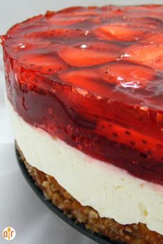 a strawberry cheesecake is shown on a plate