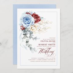 a wedding card with flowers and leaves on the front, in blue and white colors