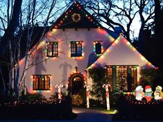 a house decorated with christmas lights and decorations