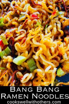 a close up of some noodles and vegetables in a bowl with the words bang bang ramen noodles