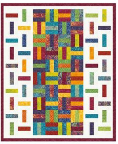 a colorful quilt with squares and lines on it