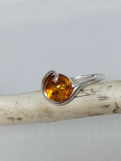 Statement small silver ring, decorated with genuine Baltic amber's the center piece in the design.Absolutely stunning everyday amber jewelry. Material : Natural Baltic Amber with sterling Silver Color : Green ,Honey ,Yellow Dimensions  :  10 mm Color green size  :   7  US Color honey  size ;  8   US Color yellow size  :  7 1/2  ,  US Finish   :  Polished All our product handcrafted. All product sent by us securely packaged. Amber Hallmarked Promise Ring, Sterling Silver Amber Birthstone Rings, Amber Cabochon Ring For Anniversary, Baltic Amber Ring For Anniversary, Silver Baltic Amber Rings As Gift, Amber Topaz Sterling Silver Ring, Nature-inspired Amber Jewelry With Natural Stones, Sterling Silver Amber Ring, Adjustable Sterling Silver Amber Ring