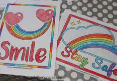 two stickers with the words smile and stay safe written on them, sitting next to each other