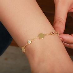 This Gold Disc Bracelet with Custom Initial Engrave and Personalized Birthstone is a perfect blend of elegance and sentimentality, available in 14k solid gold, sterling silver, or gold-filled options. Each 8mm disc can be personalized with an engraved initial and a solitaire birthstone, making it a unique gift for any special occasion. You can also add multiple discs and birthstones to create a one-of-a-kind piece that celebrates family, friendship, or meaningful moments. Featuring all available gemstones including sapphire, emerald, ruby, amethyst, and more, this versatile bracelet makes a great gift for Christmas, birthdays, or as a bridesmaid gift. The dainty design makes it perfect for everyday wear or special occasions, and its personalization options make it an unforgettable keepsake Personalized Elegant Crystal Bracelet, Elegant Gold Crystal Bracelet Personalized, Elegant Crystal Bracelet For Birthday, Elegant Gold Bracelet For Birthday, Elegant Rose Gold Bracelets For Birthday, Elegant Jubilee Bracelet For Birthday, Monogram Bracelet, Disc Bracelet, Bracelet Christmas